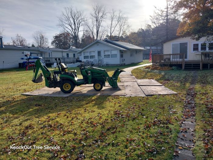 Plywood pathway for the tractor to hail brush and logs to the chipper
